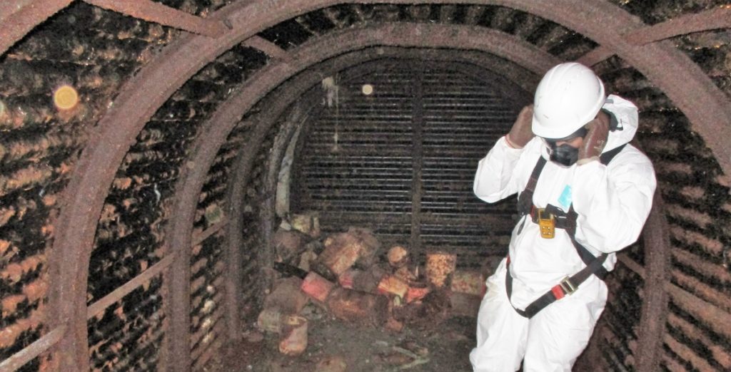 Confined space team at various waste removal from an underground shelter