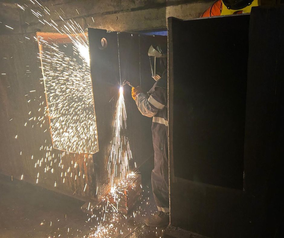 Plasma cutting to safely remove an underground tank in a historical site